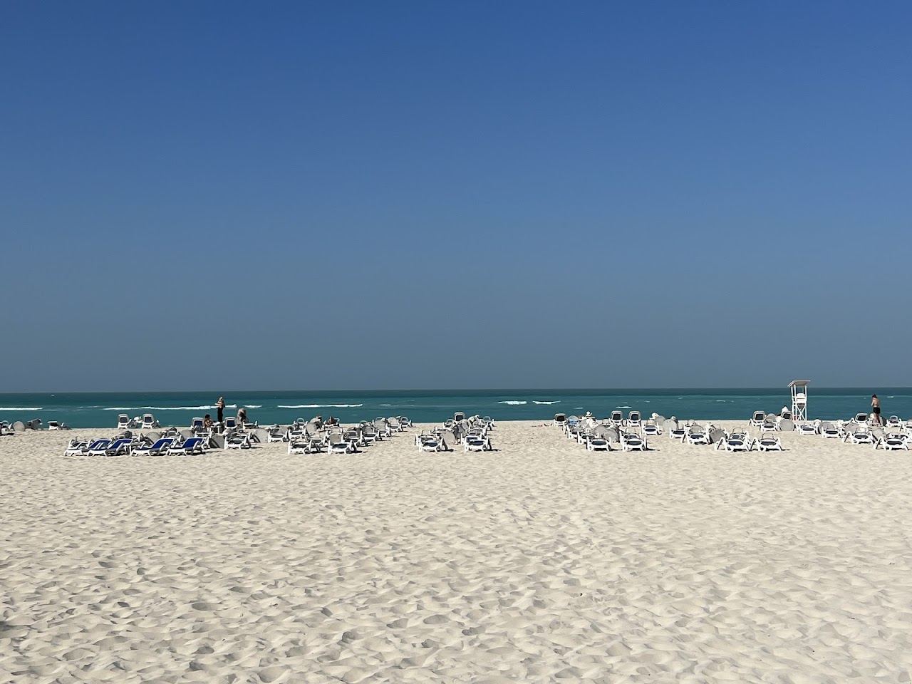 Calm turquoise water over pale sand at Saadiyat Beach in Abu Dhabi