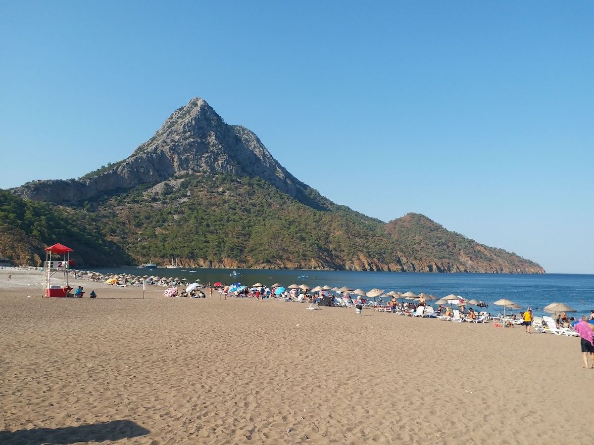 Loungers and calm shallow water on the sheltered crescent of Adrasan bay south of Antalya