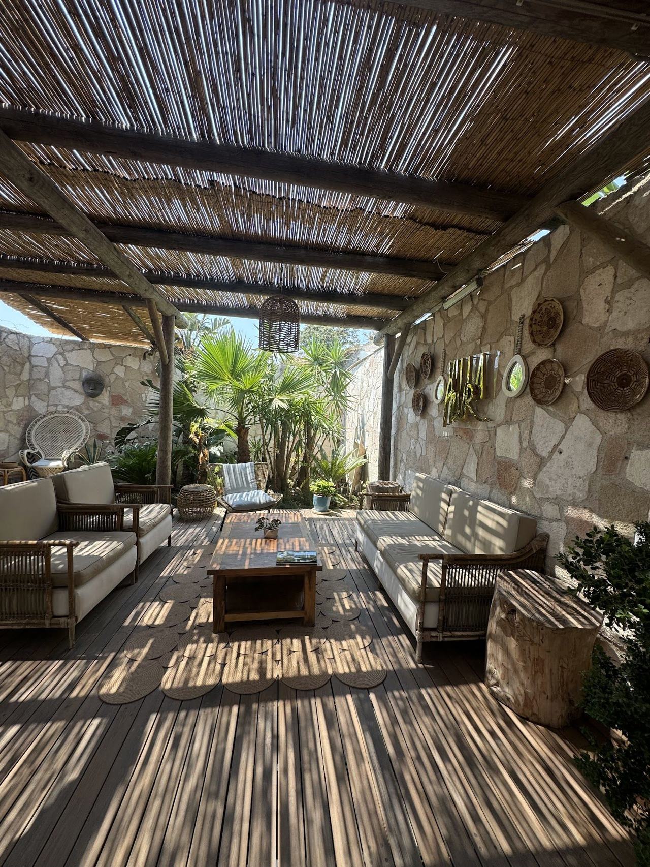 A smart beach club with loungers on a calm turquoise Bodrum cove