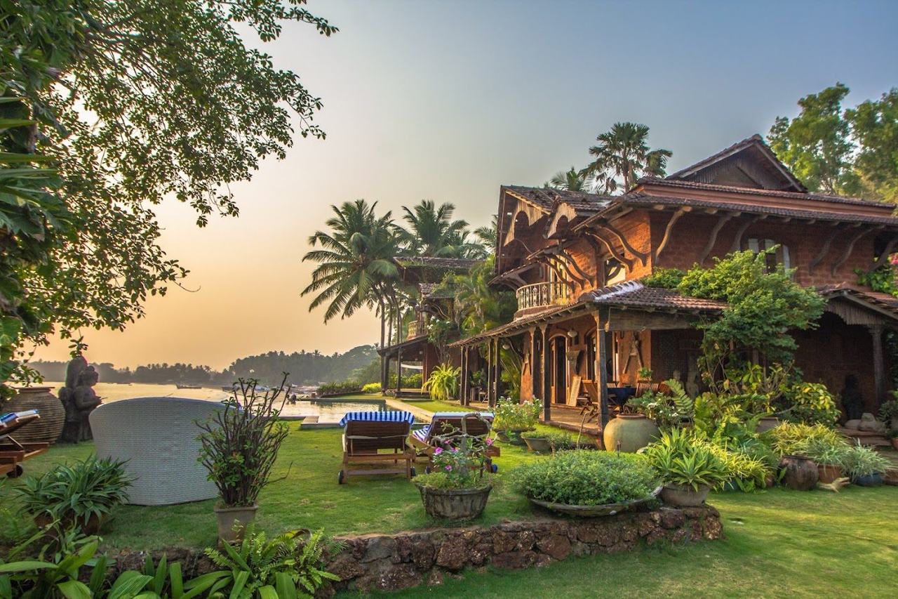 A calm palm fringed bay beside a stylish small hotel in the quiet south of Goa