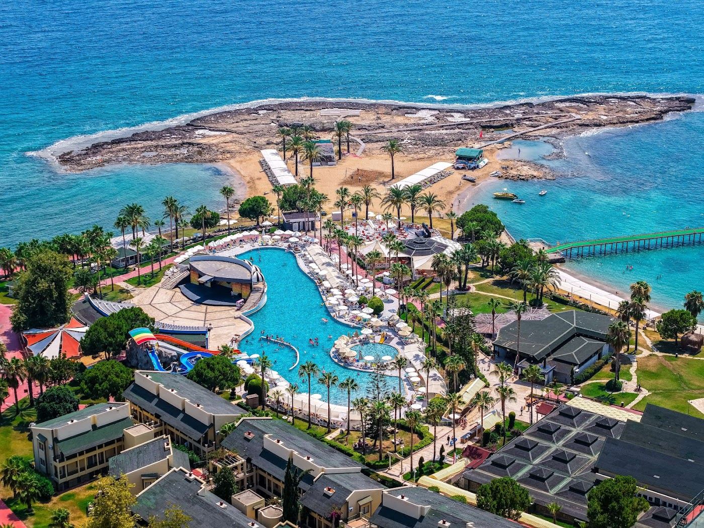 Pine backed golden sand and shallow clear water at Avsallar Beach west of Alanya