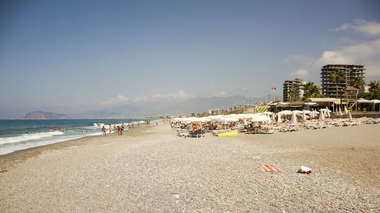 Quiet golden sand and clear water below the Taurus mountains at Kargicak Beach east of Alanya