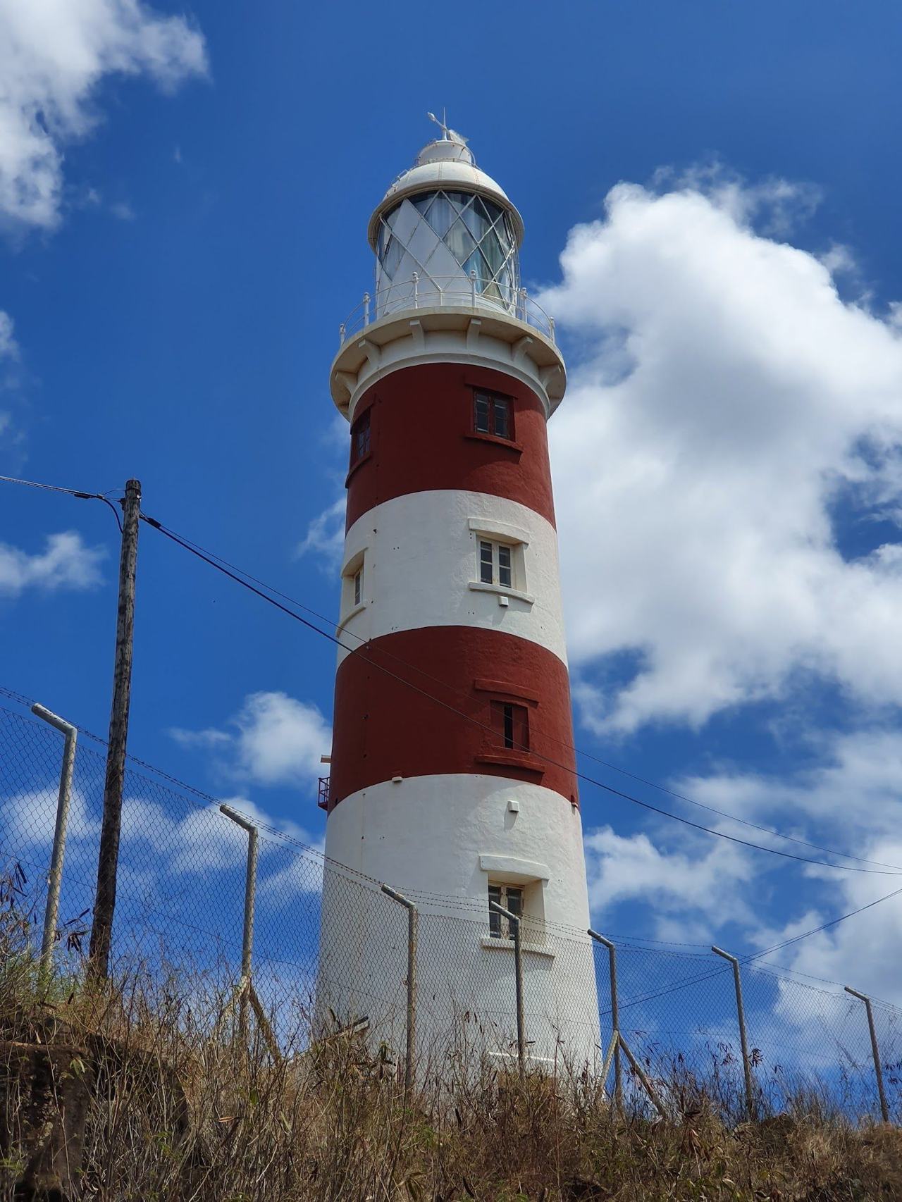The coast at Albion in west Mauritius with its red and white lighthouse on the point