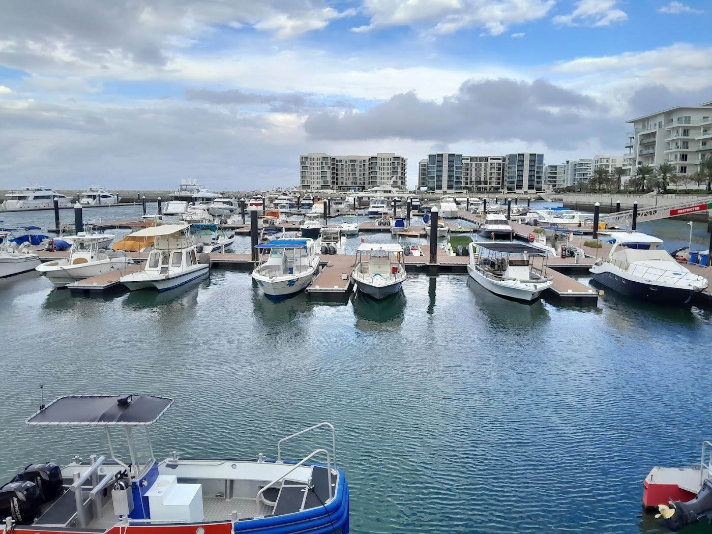 Marina and groomed beach at Al Mouj in Muscat, Oman