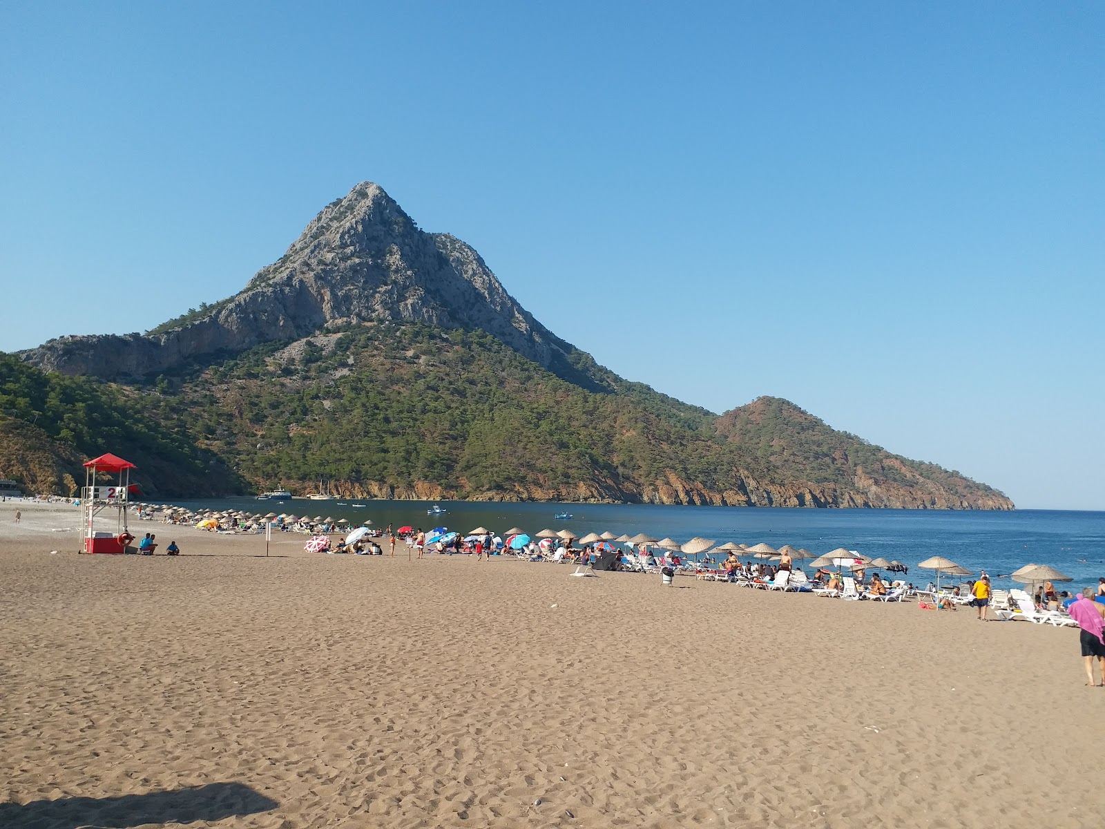 The sheltered calm bay at Adrasan near Olympos on the Antalya coast with gentle clear water between green headlands