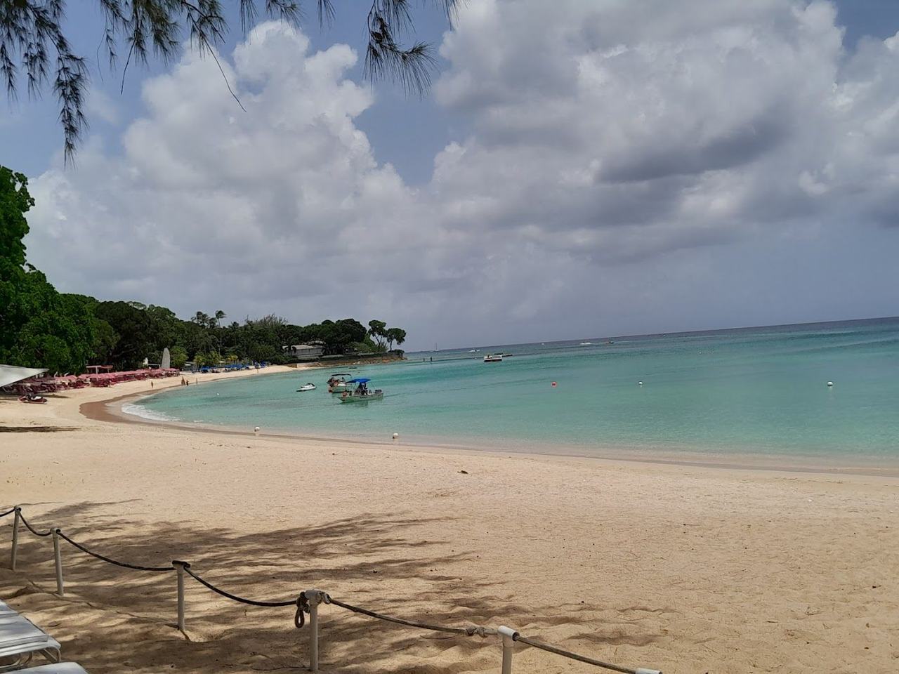 Warm, dry and breezy at the tail of the Caribbean season, with calm west coast swimming.