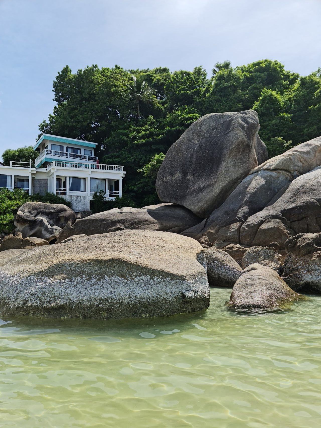 The small sandy cove and clear water of Silver Beach on Koh Samui