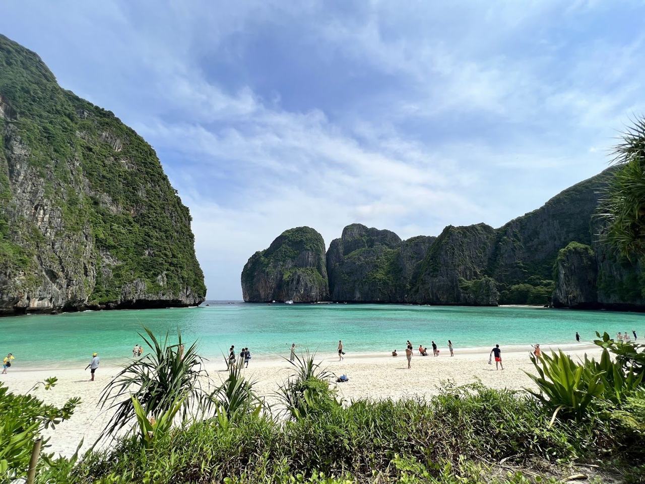 Cliffs encircling the bright water and sand of Maya Bay on Koh Phi Phi Leh
