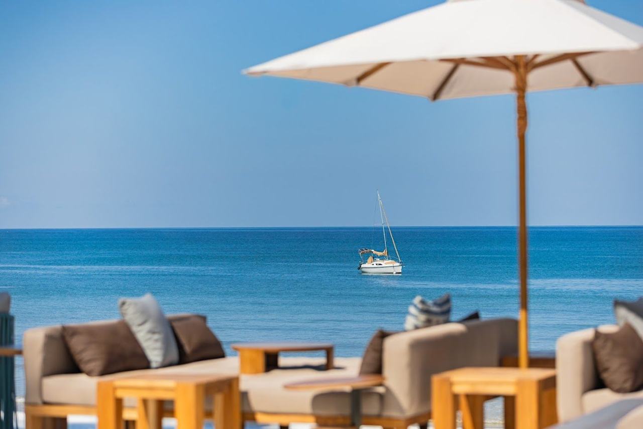 The dressed up flagship of Phuket's Bang Tao strip, with daybeds on the sand and a long restaurant and lounge behind.