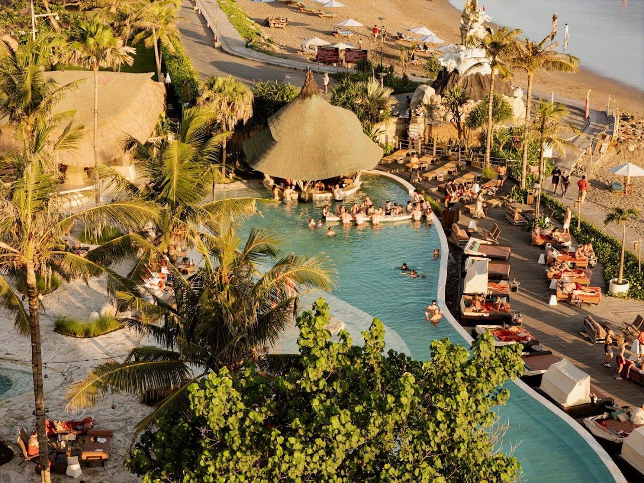 A newer Mediterranean leaning club on the Canggu coast, with a sculpted pool, palms and a calmer daytime mood.
