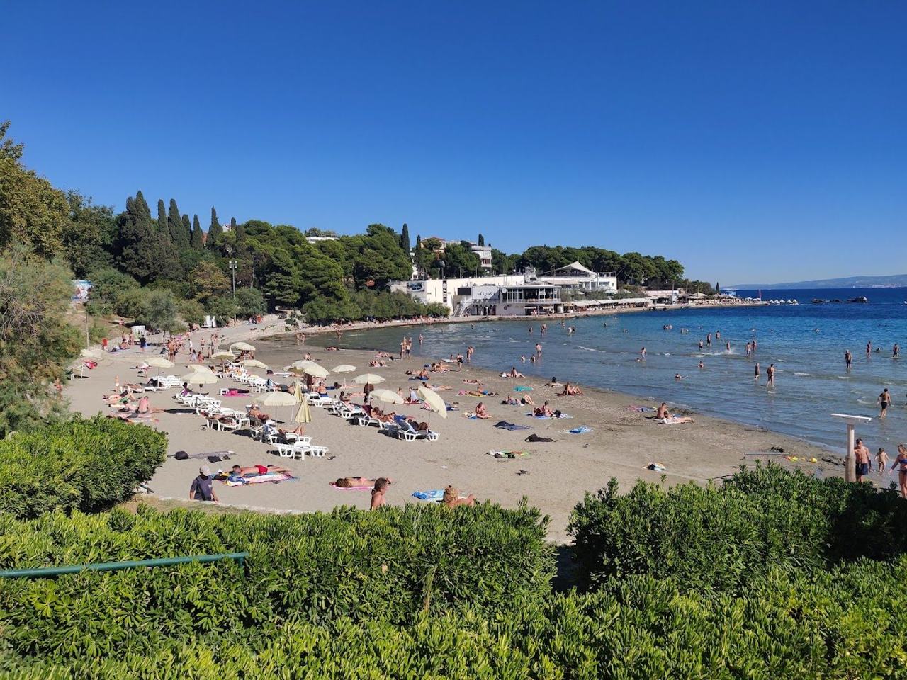 Bacvice sandy bay in Split with shallow warm water and bathers close to the city centre on the Dalmatian Coast