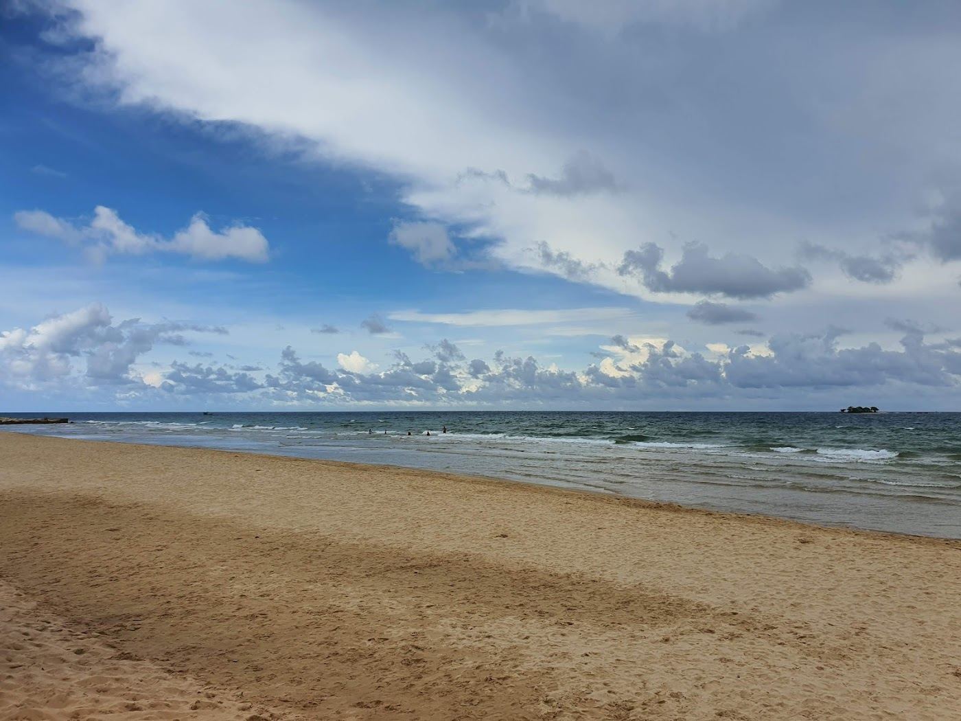 Long stretch of soft sand and calm shallow water at Bai Dai beach on the northwest coast of Phu Quoc