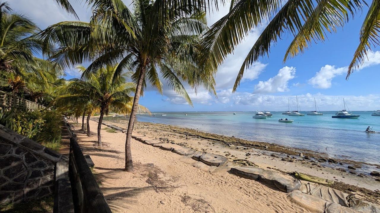 The calm lagoon at Bain Boeuf in north Mauritius with Coin de Mire island offshore