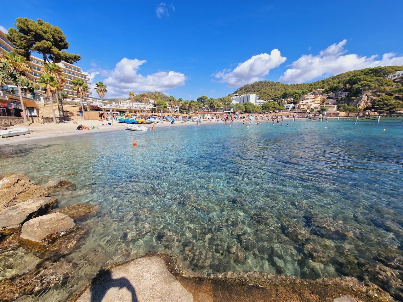 The islet restaurant and wooden footbridge at Camp de Mar on Mallorca