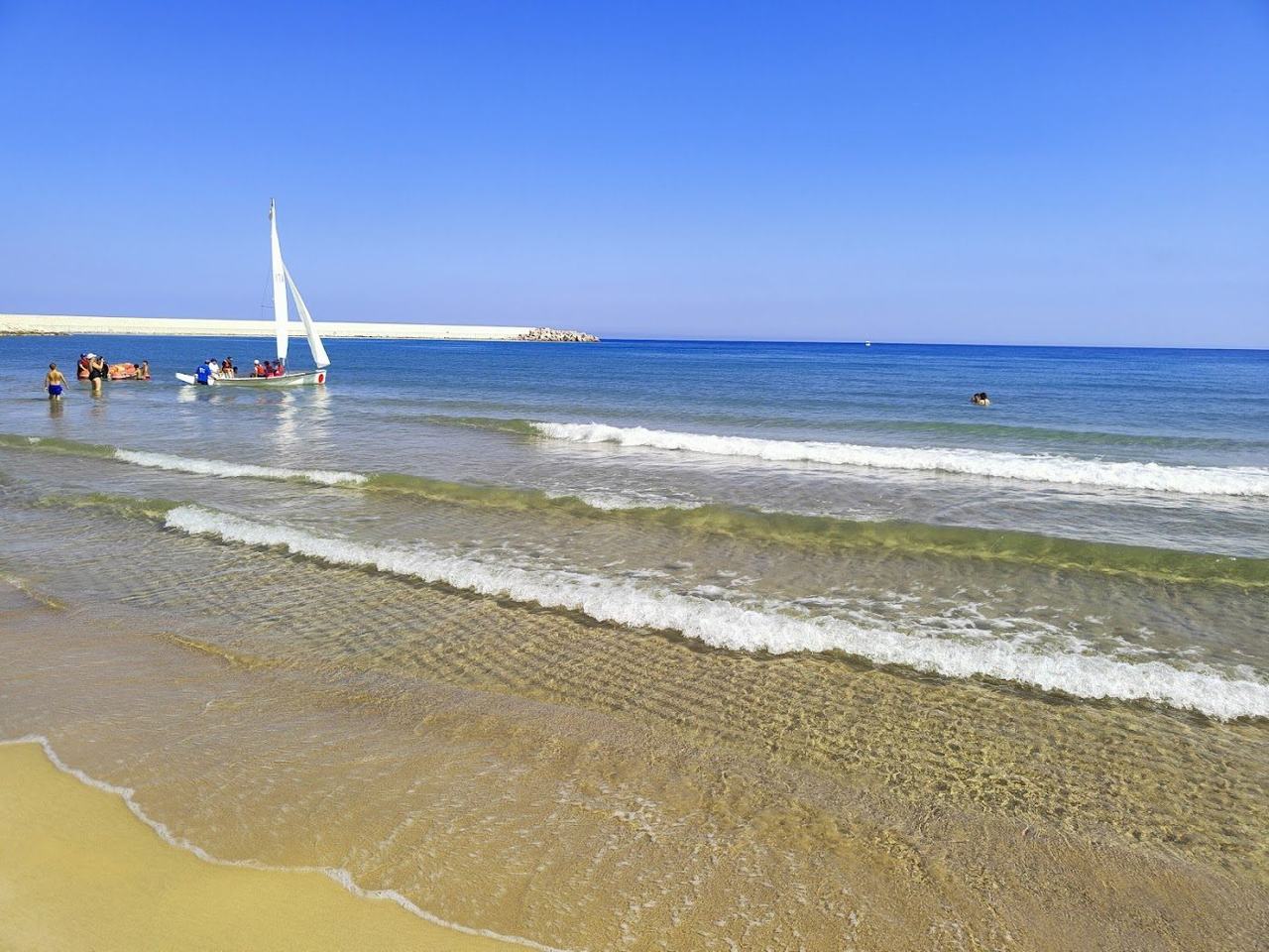 Long sandy beach and gentle shallow water on the Gulf of Castellammare at Balestrate Sicily