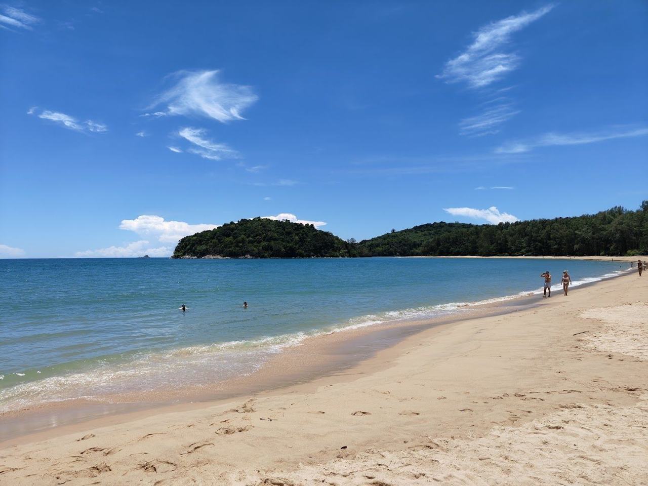 The long open sweep of golden sand at Bang Tao Beach in Phuket