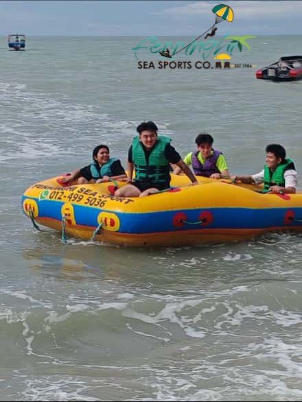 Watersports boats and gear on the sand at Batu Ferringhi in Penang