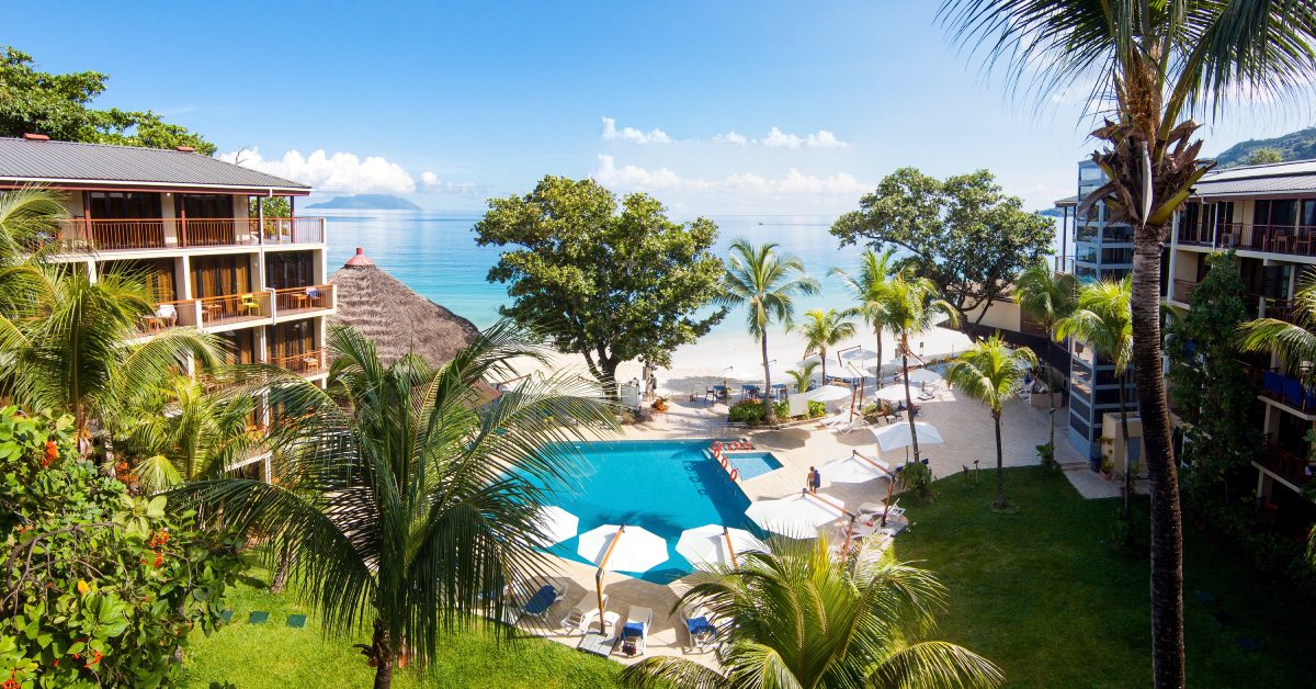 Beach frontage and loungers at the Coral Strand hotel on Beau Vallon, Mahe