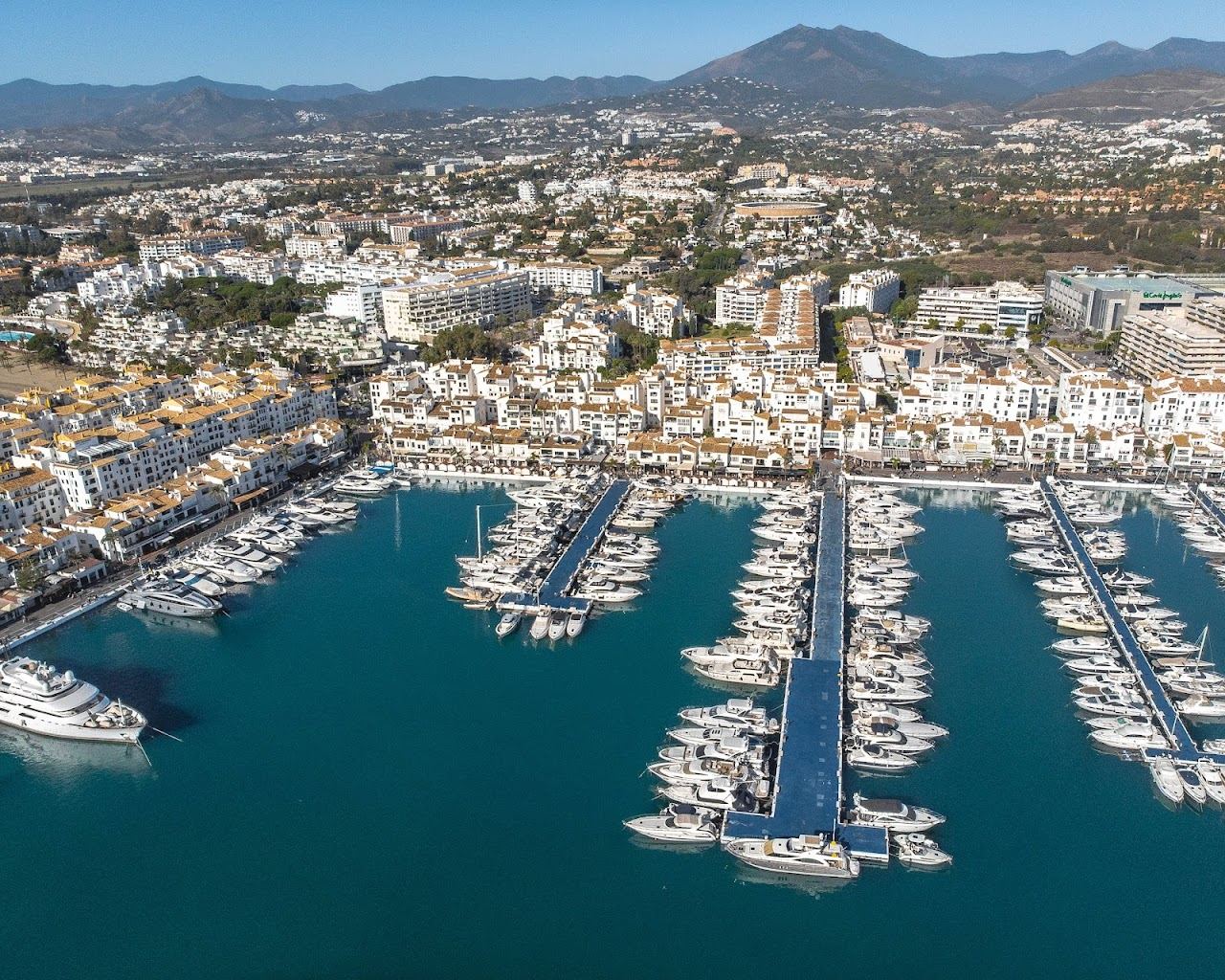 Marina, superyachts and beach club scene at Puerto Banus near Marbella