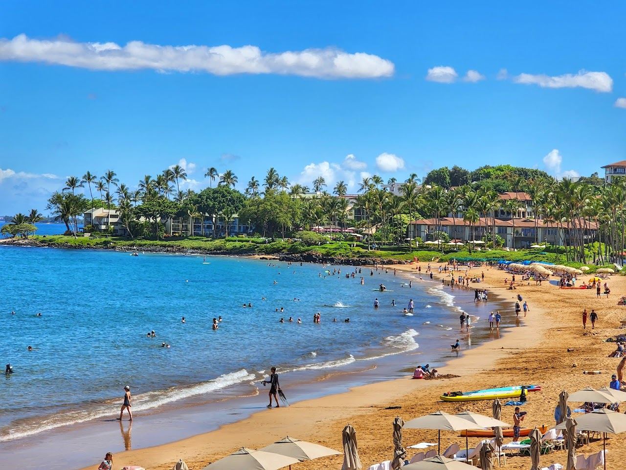 Golden crescent of calm swimmable water at Wailea beach on Maui