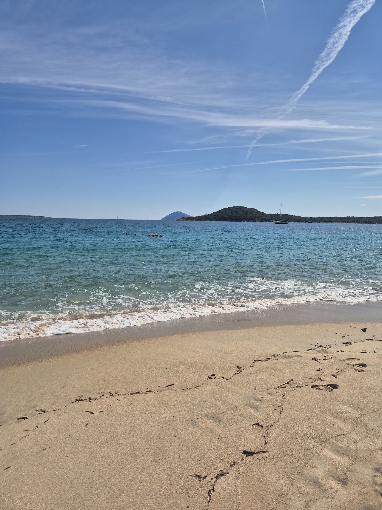 Pale sand and turquoise shallows at Liscia Ruja on the Costa Smeralda