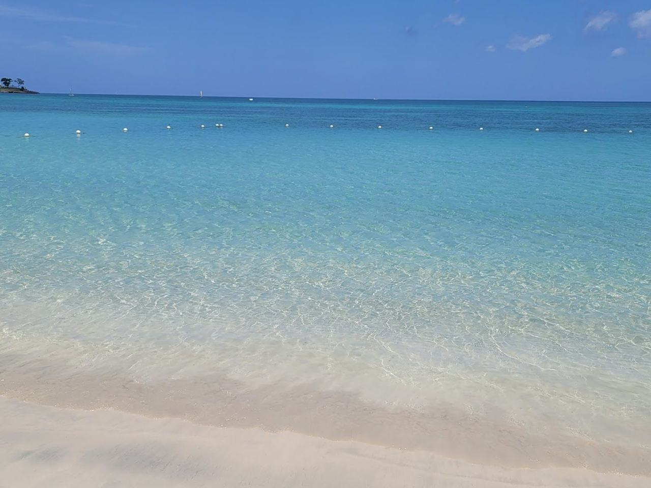 Bloody Bay Negril Jamaica calm clear water and a quiet crescent of soft white sand backed by resorts