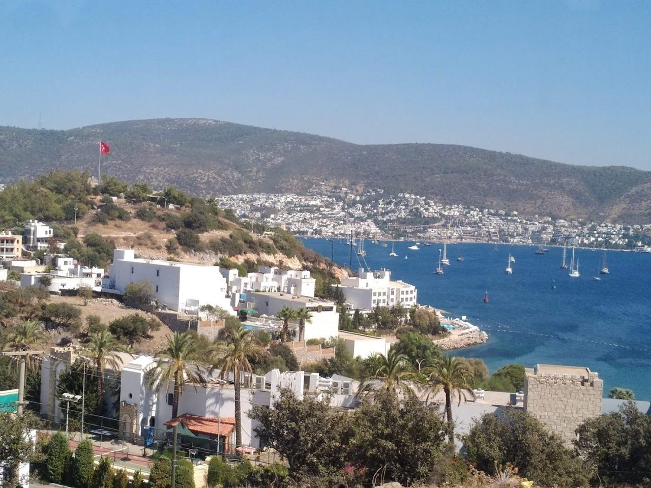 White daybeds and umbrellas at Bianca Beach near Bodrum town