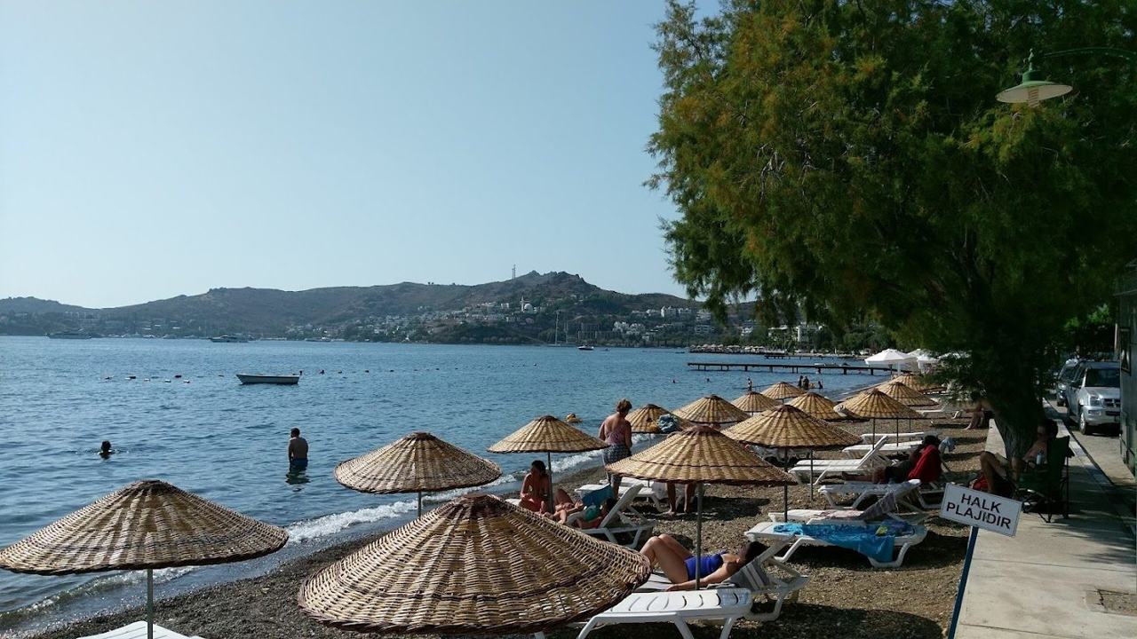 Sunbeds and clear water along a Yalikavak bay on the Bodrum peninsula