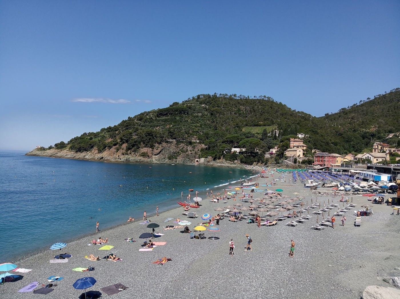 The broad sheltered beach of Bonassola below the green hills near Levanto in Liguria
