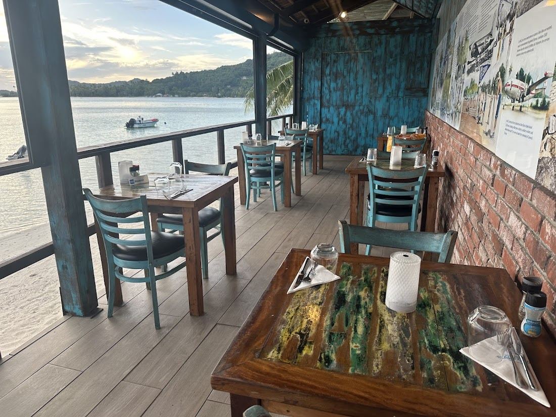Lagoonfront tables and turquoise water at Bora Bora Beach Club on Matira Beach