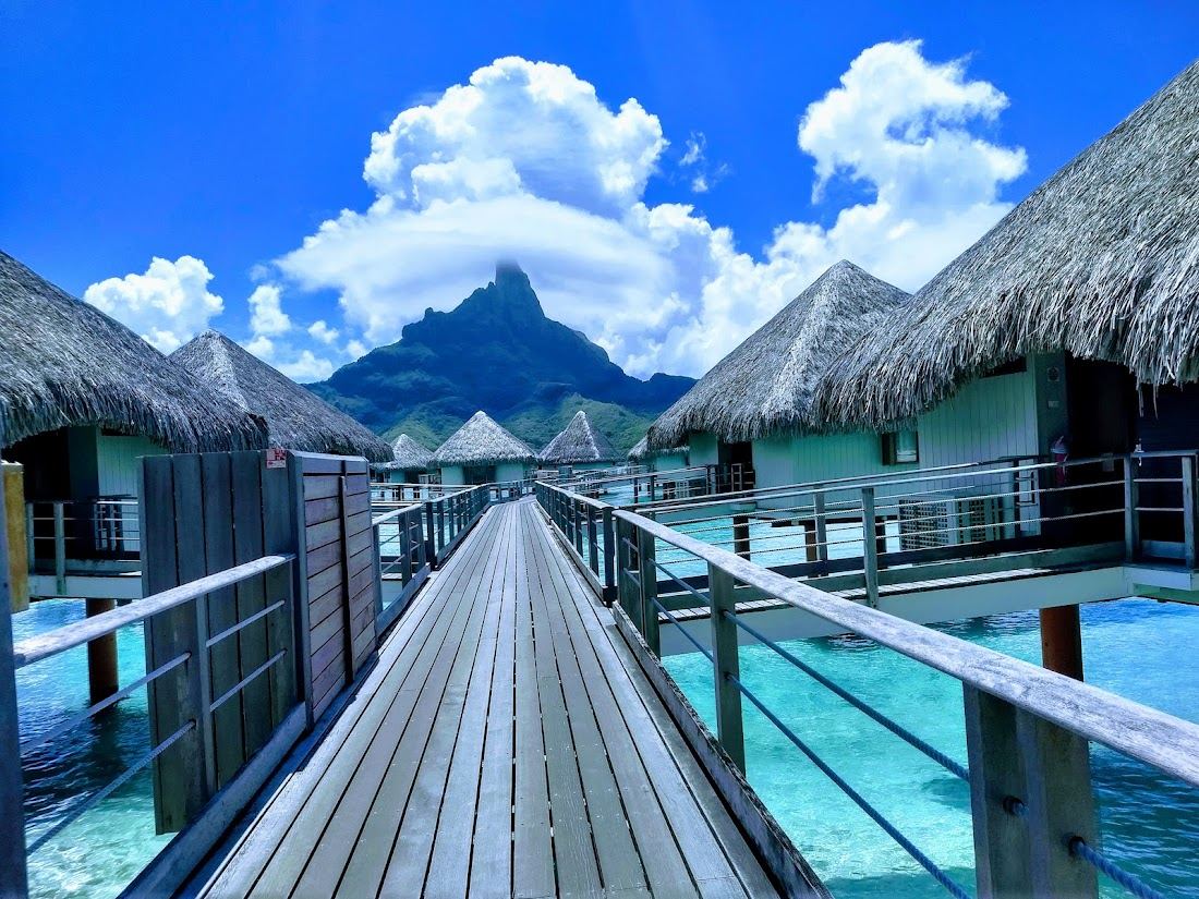 Overwater bungalows and turquoise lagoon at Le Meridien Bora Bora on Motu Piti Aau