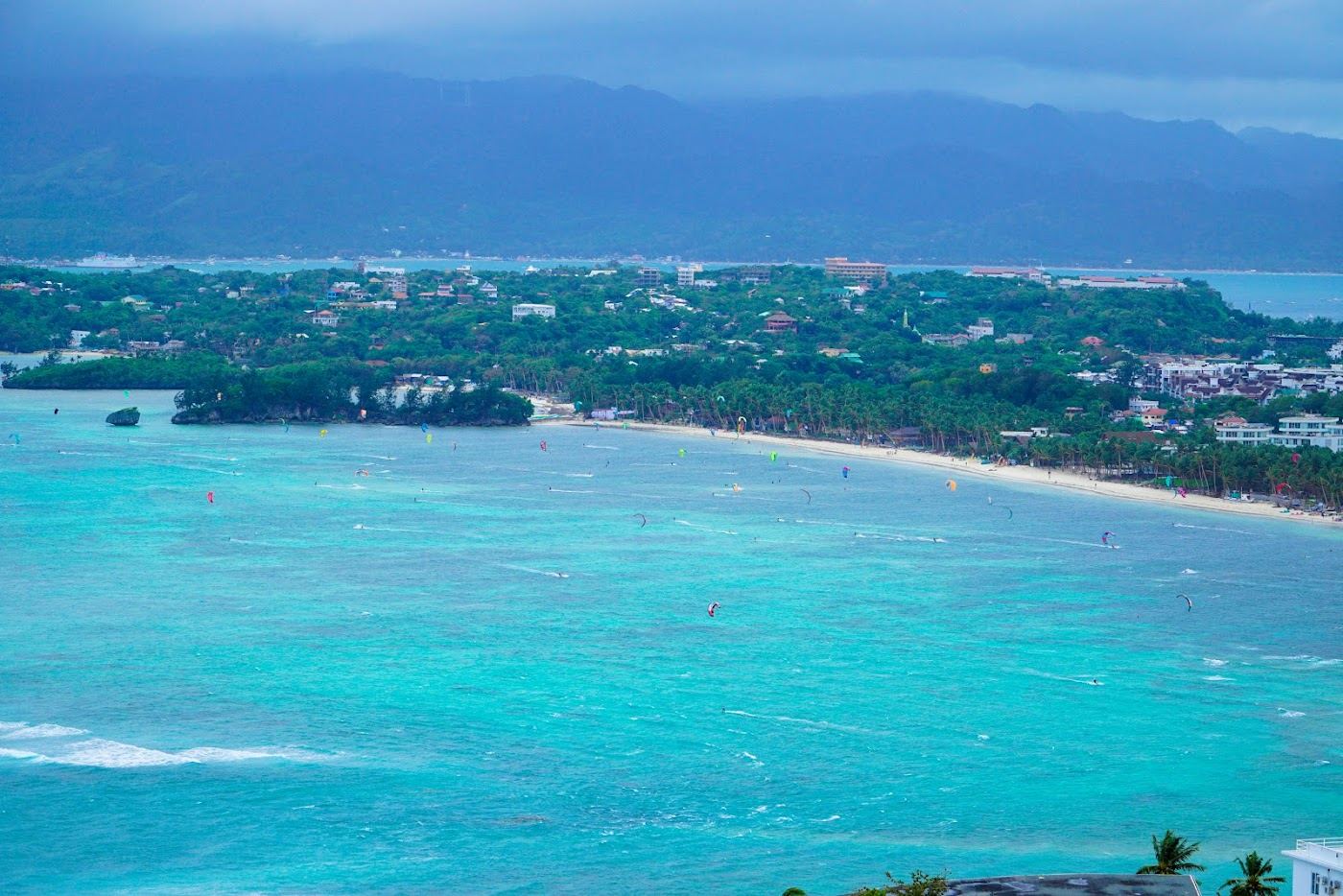Kitesurfers and a sheltered reef lagoon at Bulabog Beach on the eastern side of Boracay