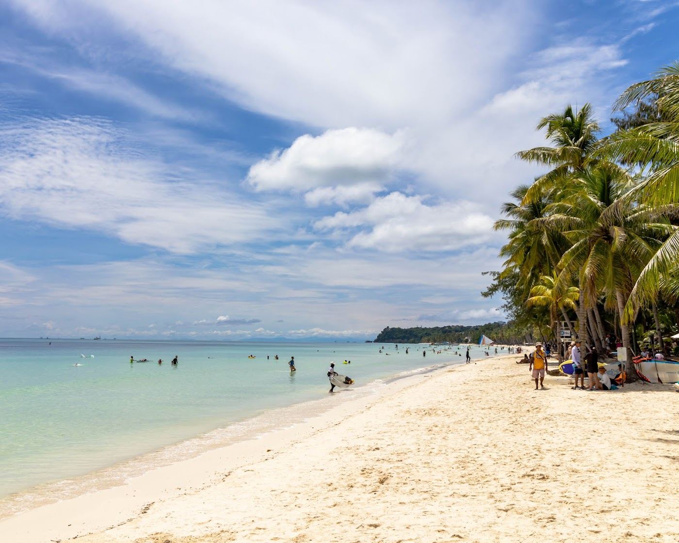 Beachfront bars and loungers behind the sand at Station 2 of White Beach in Boracay