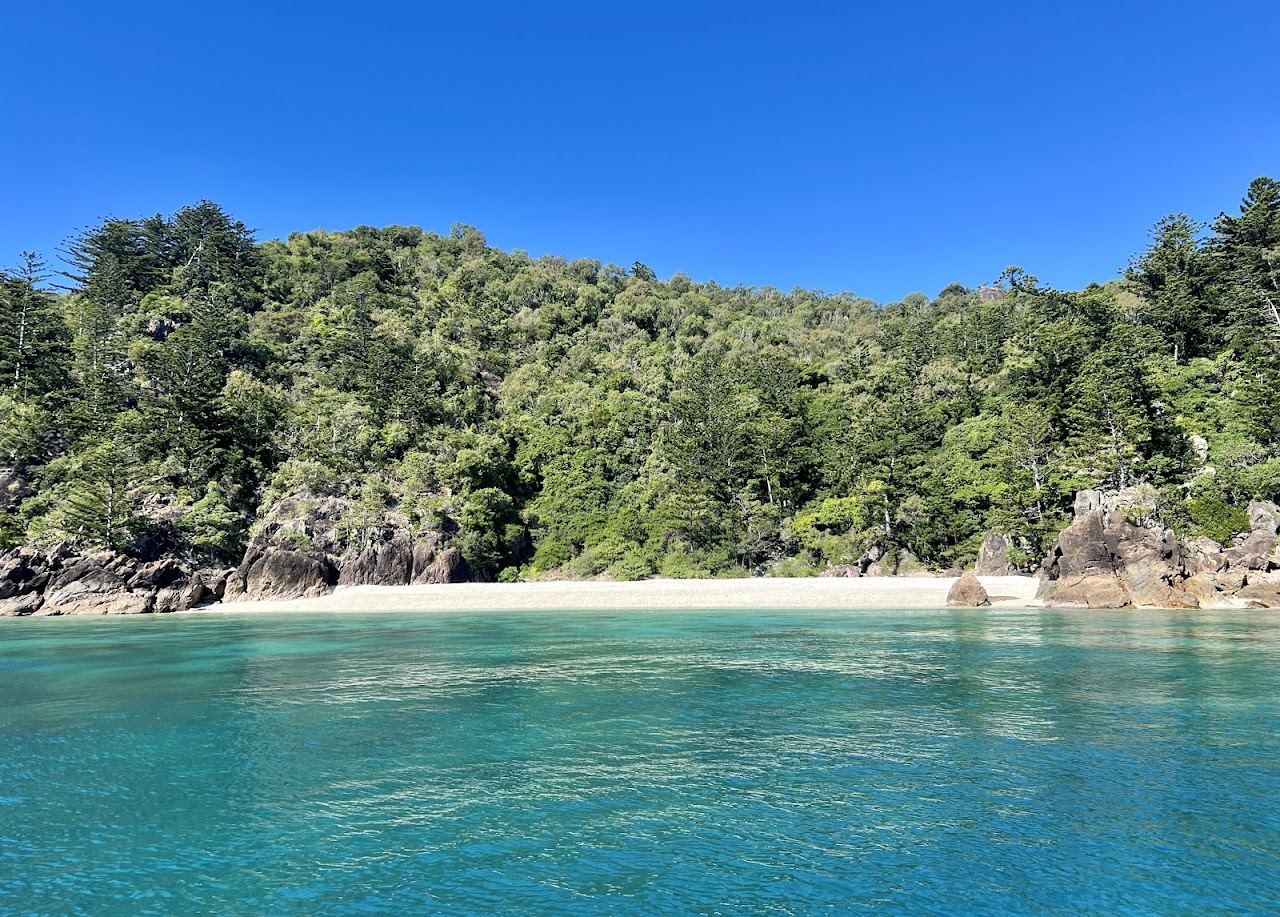 Boats at anchor in a sheltered northern bay of Hook Island in the Whitsundays