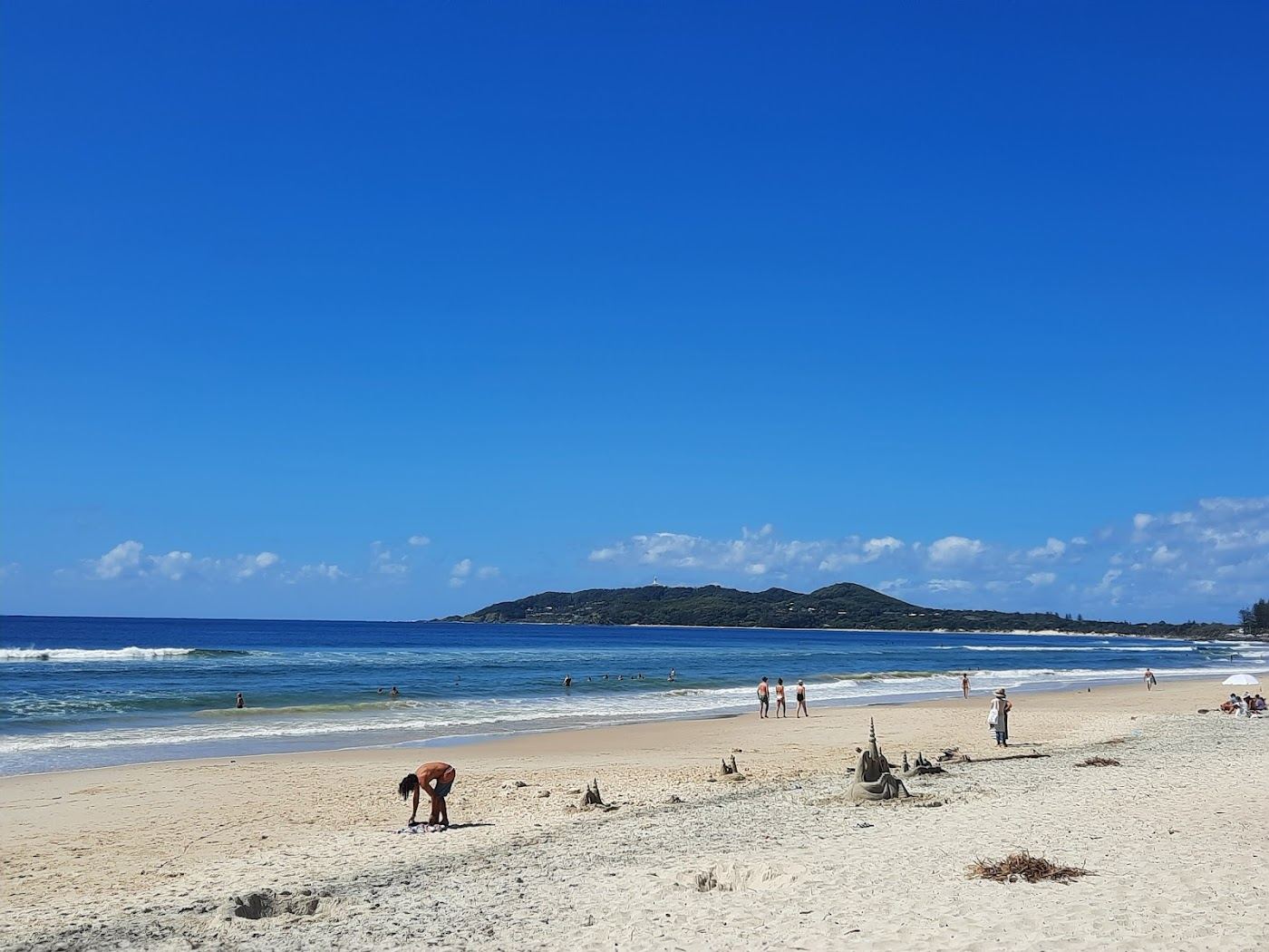 The relaxed open sand and dune backed shore of Belongil Beach west of town in Byron Bay, New South Wales, Australia
