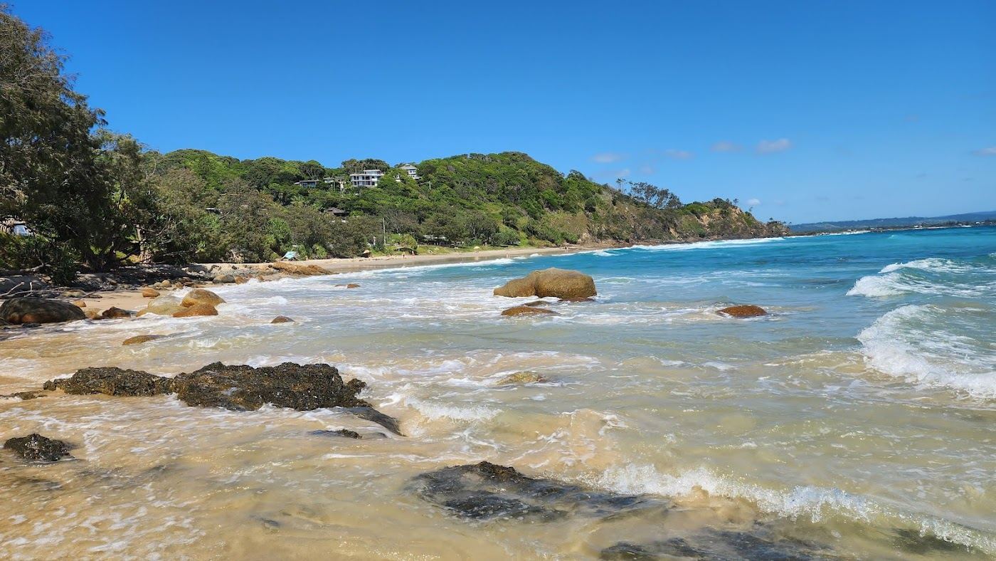 A quiet sheltered cove near the Cape Byron headland at soft morning light, ideal for couples