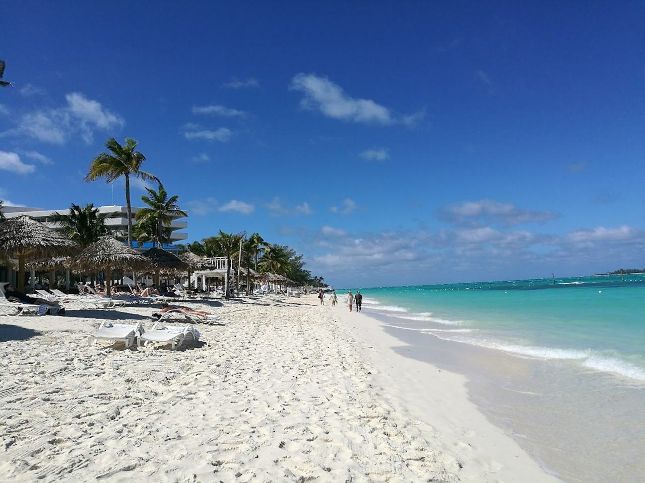 Resort lined shore and clear shallow water at Cable Beach New Providence Bahamas
