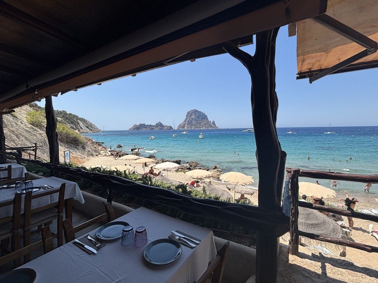 The view of the islet of Es Vedra across the clear water of Cala d'Hort in southwest Ibiza