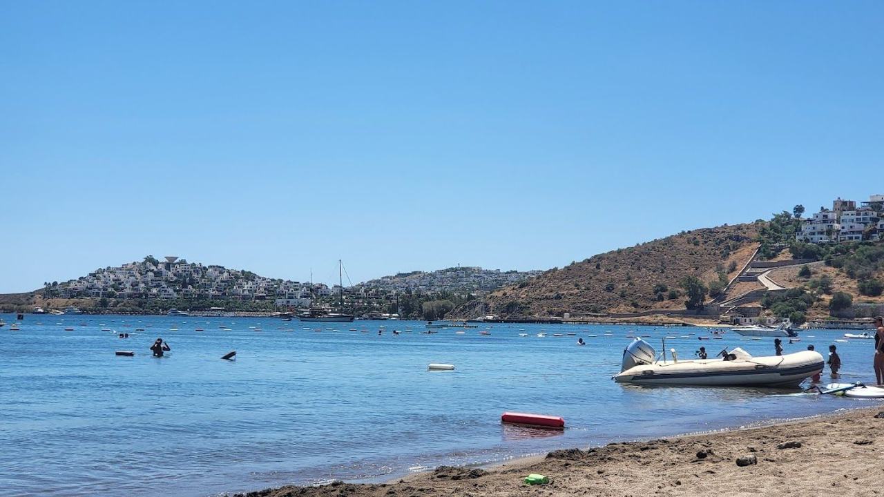 Camel Beach shallow sandy water and headland at Ortakent in Bodrum