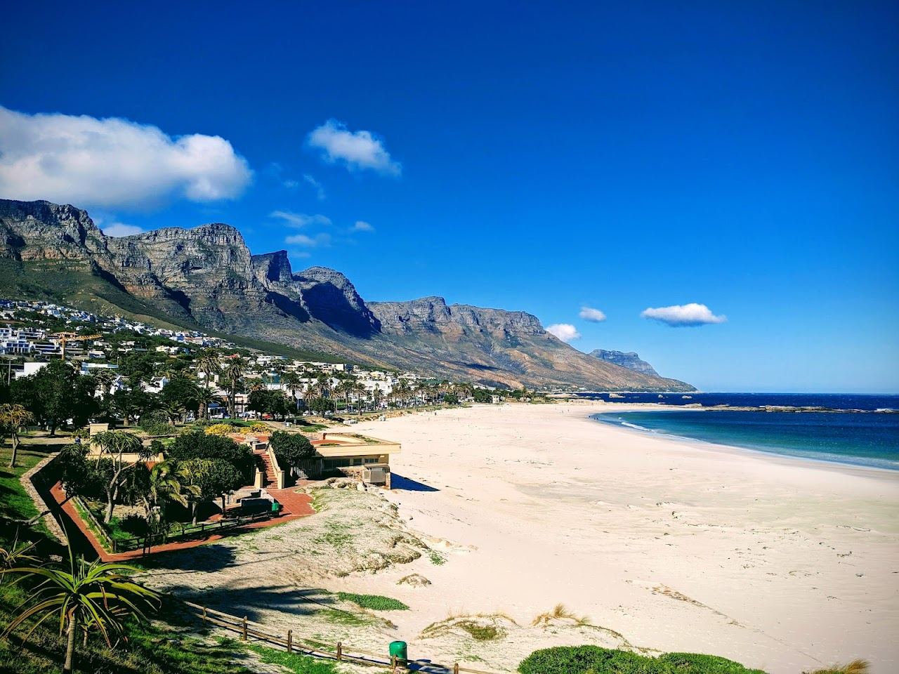Evening light over Camps Bay beach and the Twelve Apostles on the Atlantic seaboard of Cape Town