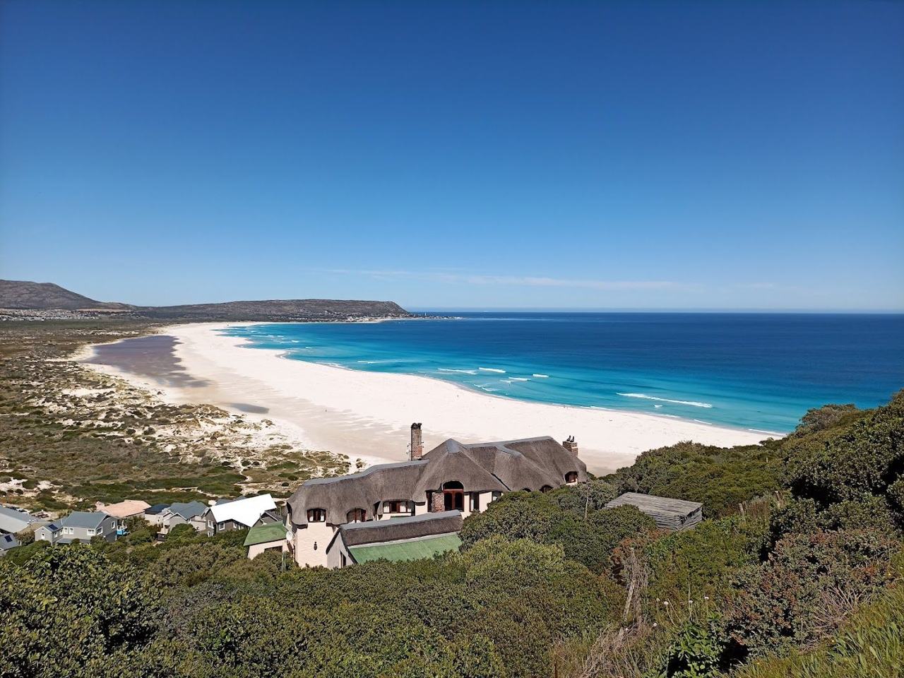 Long open surf beach at Noordhoek below Chapman's Peak near Cape Town