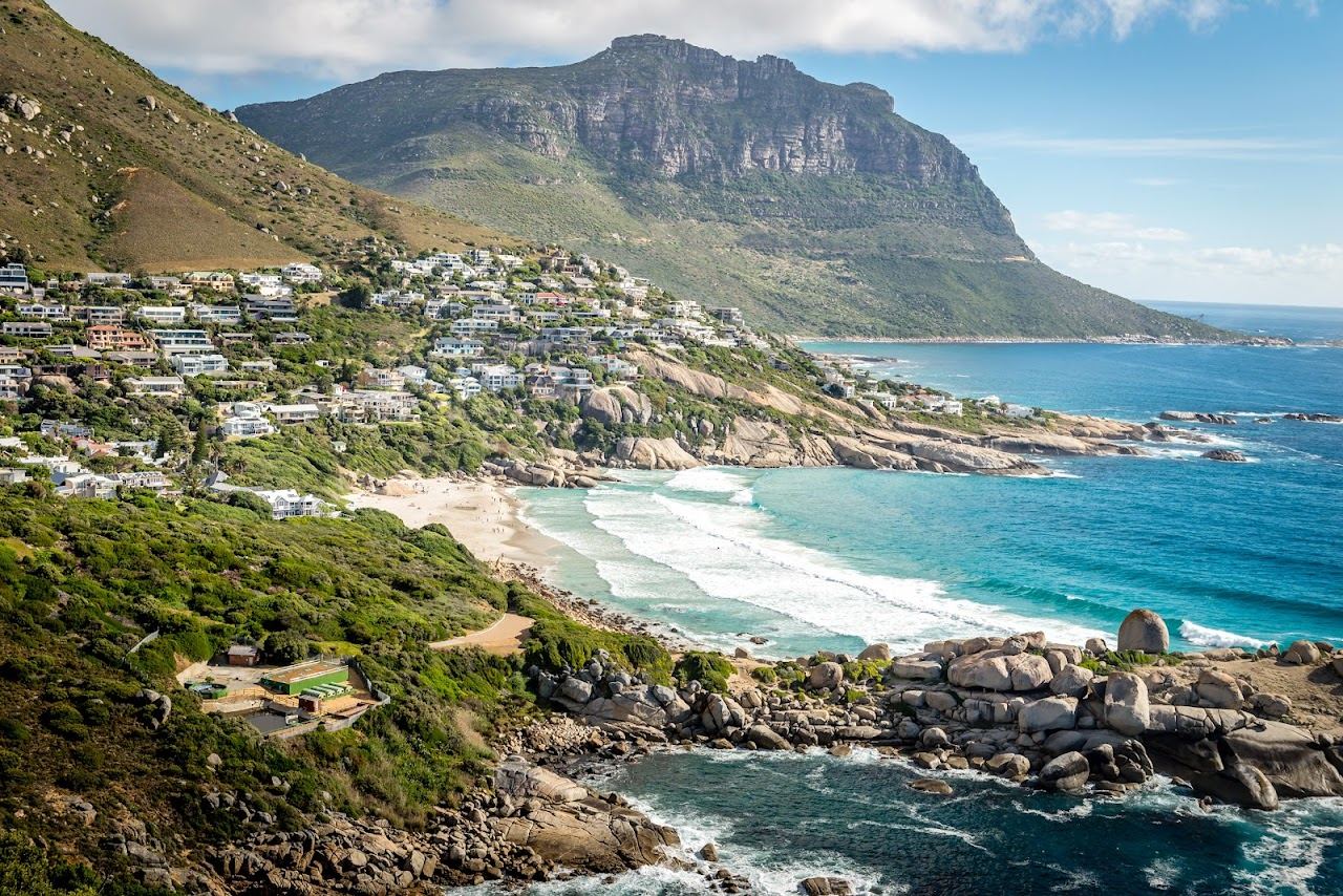 Bright white sand and granite boulders at Llandudno beach in Cape Town