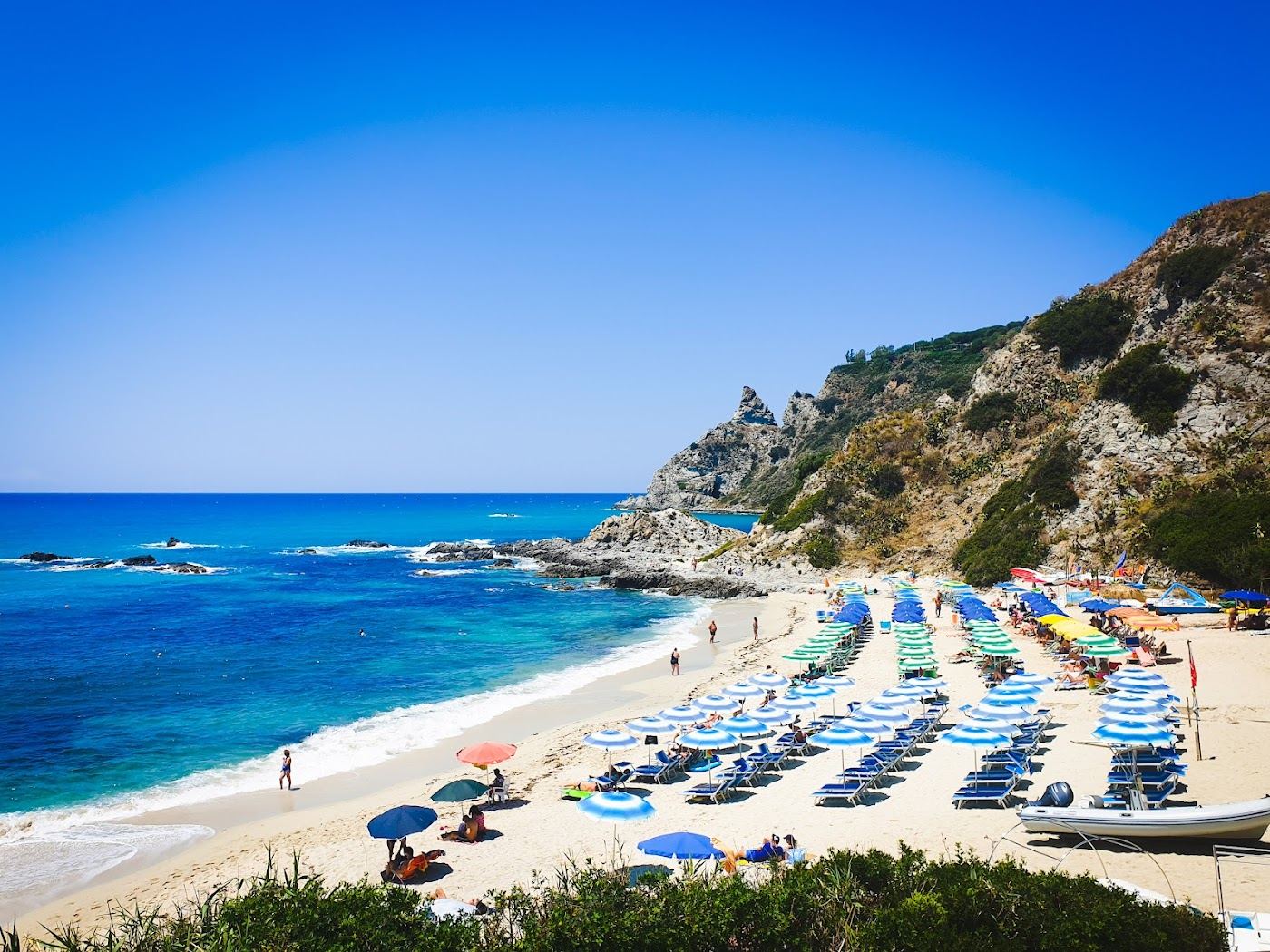 White sand coves below the granite cliffs of Capo Vaticano in Calabria
