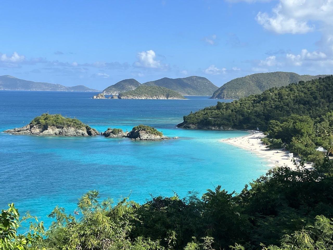 The pale sand crescent and Cay offshore at Trunk Bay on St John