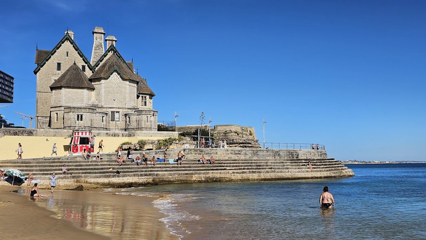 Calm sheltered town beach and still water at Praia da Duquesa in Cascais