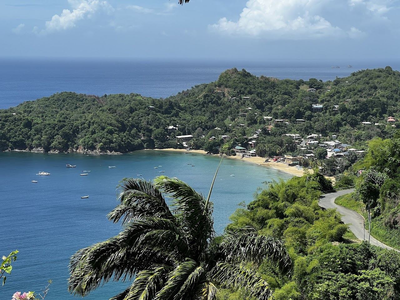 Palm backed leeward bay and fishing boats at Castara Beach used for the Tobago sunset guide on Beaches for Kings