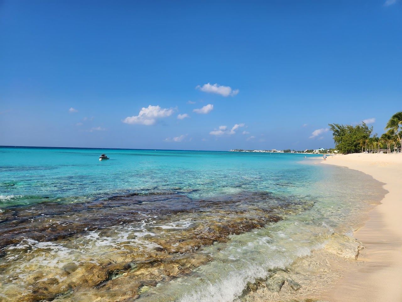 The quiet sand and clear leeward water at Cemetery Beach on the north of Seven Mile Beach Grand Cayman