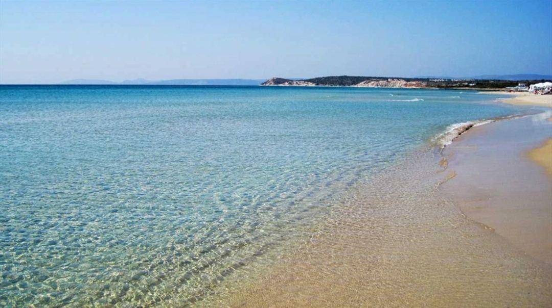 The golden fine sand and clear water of Altinkum Beach south of Cesme near Izmir in Turkey