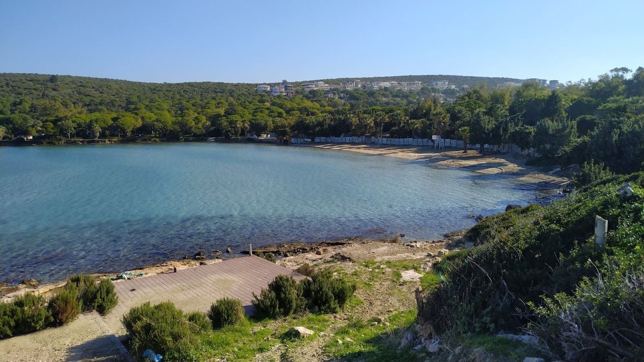 The calm clear shallow water and natural shore of Pasalimani Beach near Cesme and Izmir in Turkey
