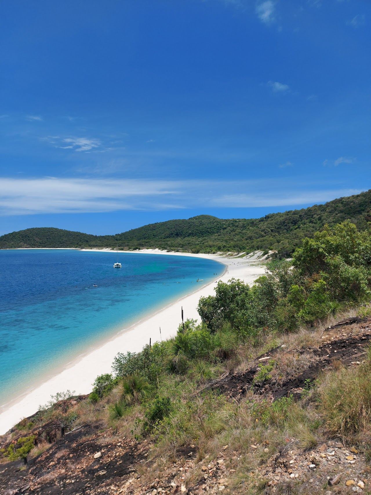Aerial of Haslewood Island and turquoise channel near Chalkies Beach in the Whitsundays